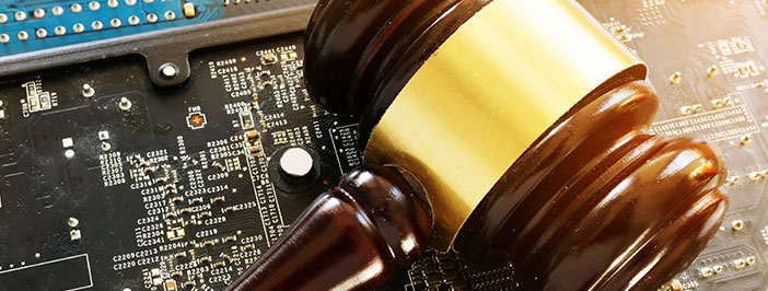 Gavel on top of computer microchip